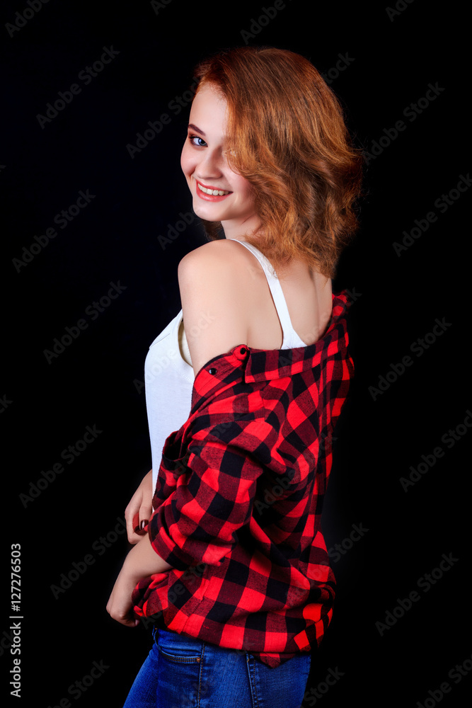 Portrait of beautiful girl. Freckled woman with wavy red hair an