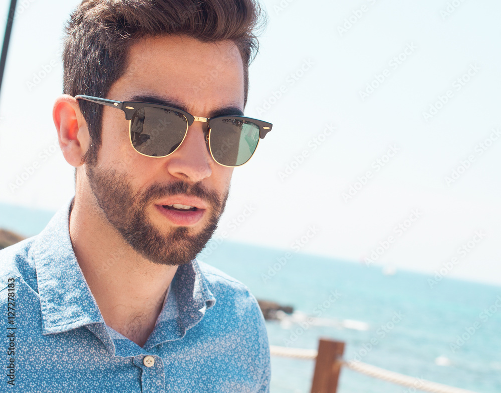 young man thinking in the beach young man thinking in the beach