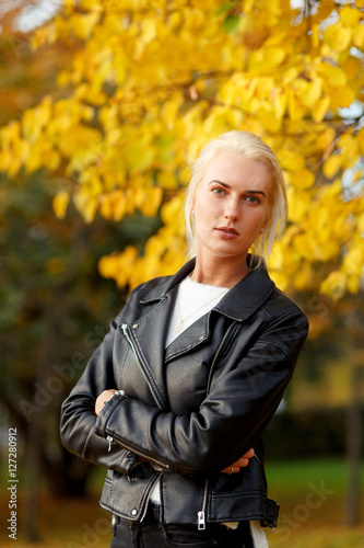 Portrait of modern young woman in autumn park © snedorez