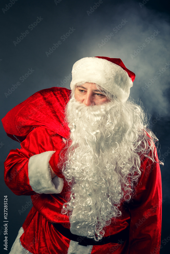 Santa Claus carries gifts. Santa Claus carries gifts.