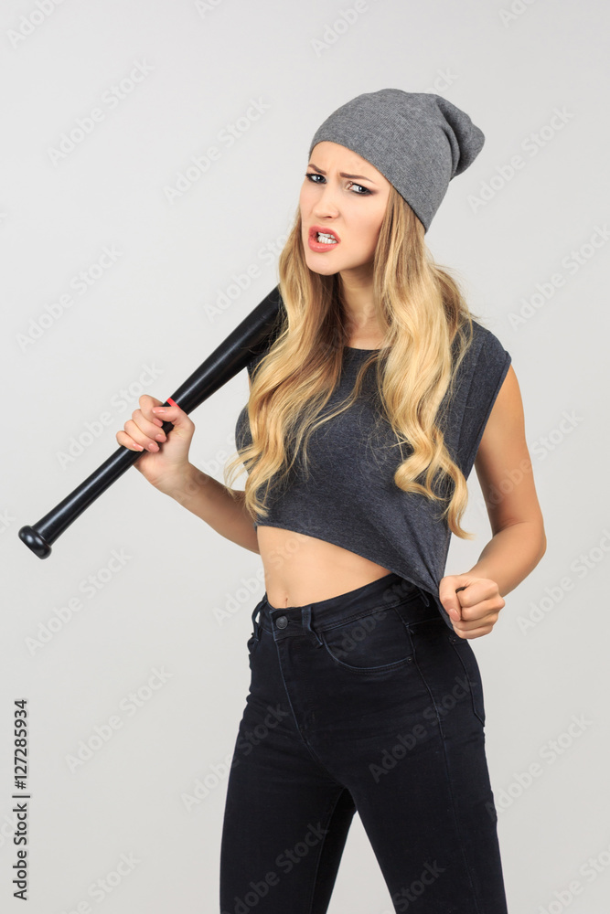 Cool hot fashionable woman bandit dressed in hat with baseball b Cool hot fashionable woman bandit dressed in hat with baseball b