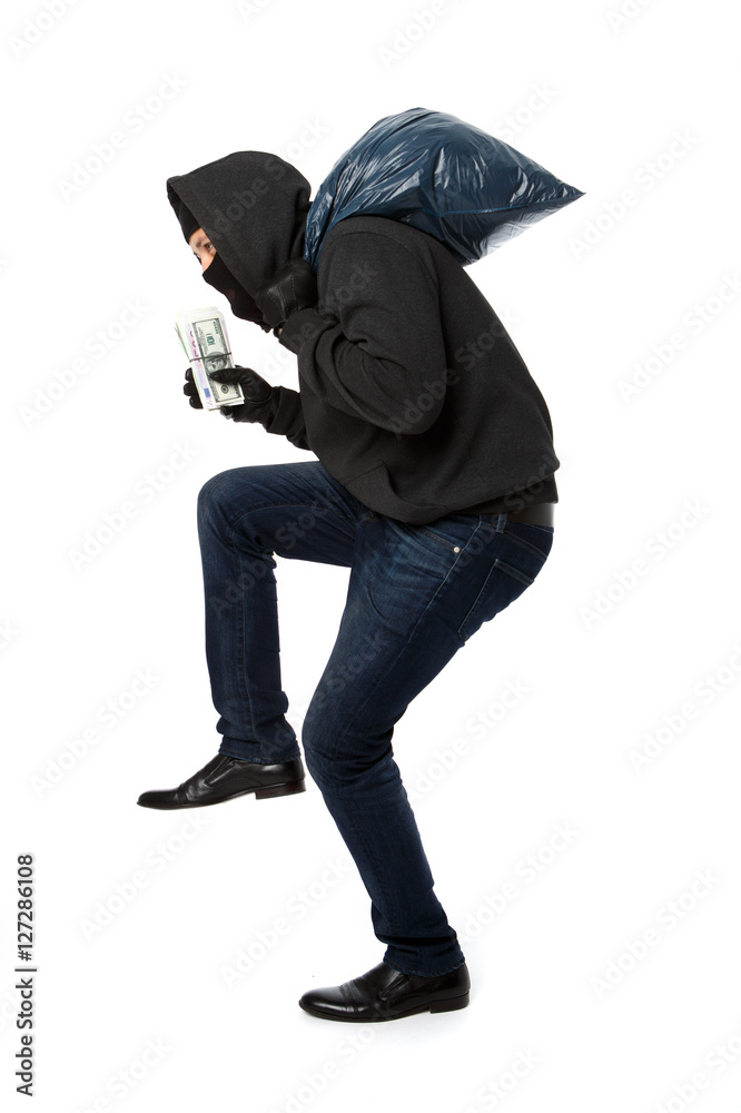 Thief with bag on shoulders