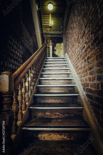 Fototapeta Naklejka Na Ścianę i Meble -  Old wooden staircase inside a building