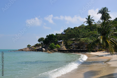 Tropical beach with houses on the island Koh Samui  Thailand