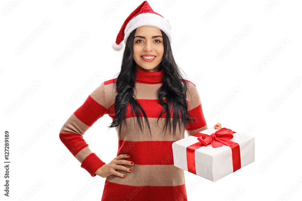 Happy woman wearing a Christmas hat and holding present Happy woman wearing a Christmas hat and holding present