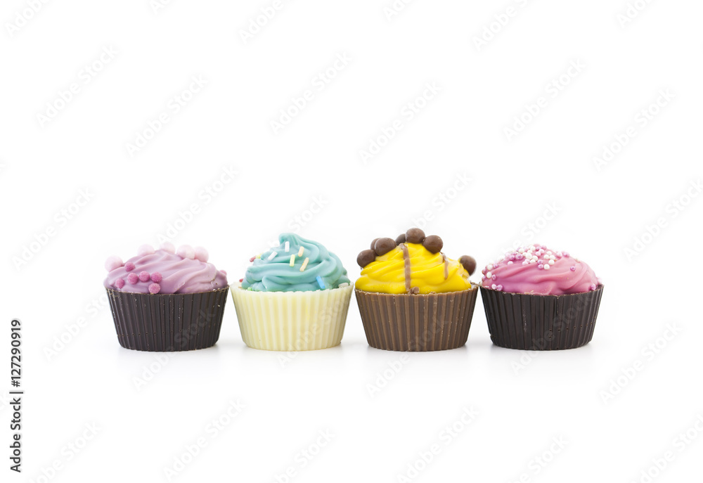 Assorted multicolored cupcakes in a row