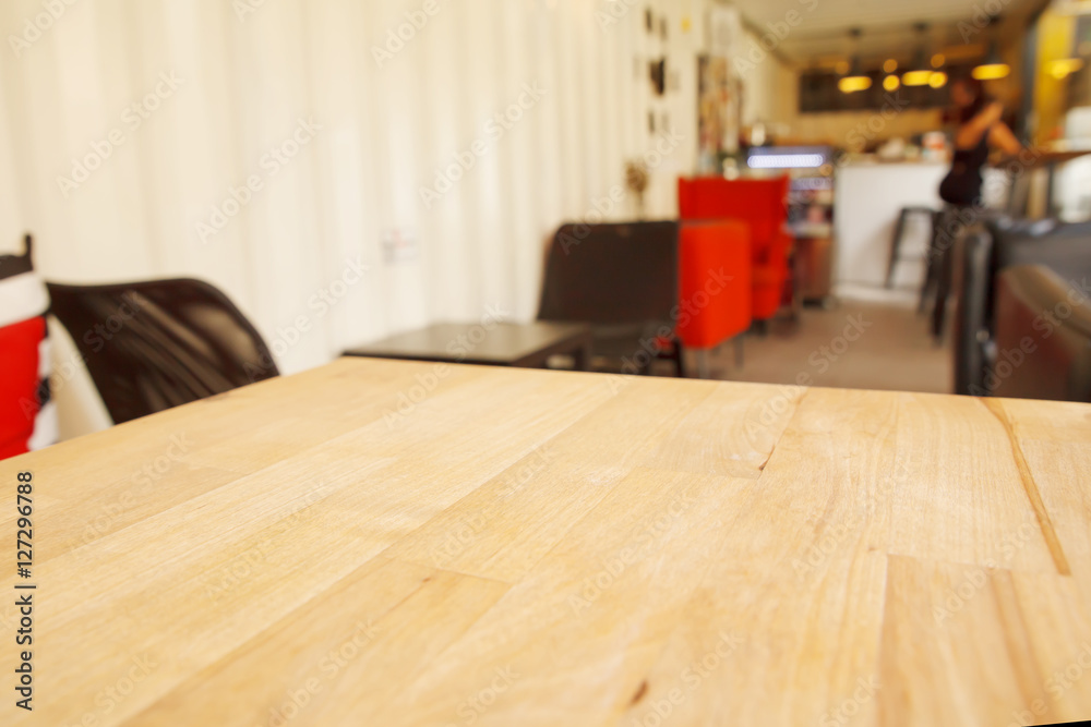 Empty wood table and blurred cafe light background. Empty wood table and blurred cafe light background.