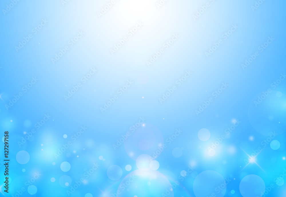 Soft Blue sparkles below glitter rays lights bokeh abstract background/texture.