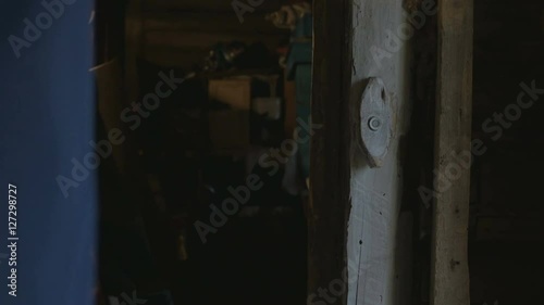 the boss man unlocks the door, metal lock and enters the room of the barn, 4K