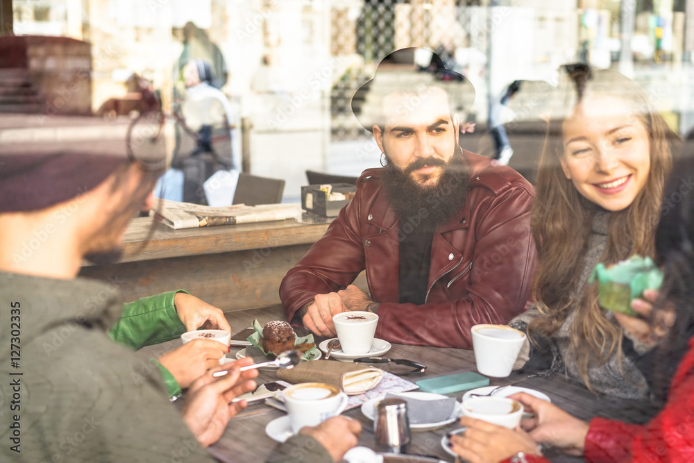 Group of friends enjoying cappuccino and latte macchiato together Group of friends enjoying cappuccino and latte macchiato together