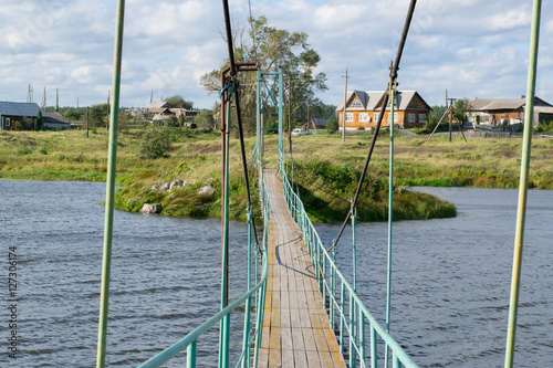 Obraz na płótnie Russian rural landscape with a bridge over river w salonie