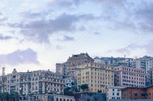 Buildings with multitude of architectural styles in the San Teodoro residential district of Genoa, seen from the Piazza Principe railway station in the evening