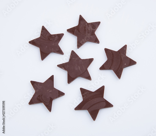 Chocolate or chocolate star on a background.