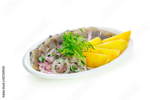 isolated pieces of salt fillet herring with onion photo