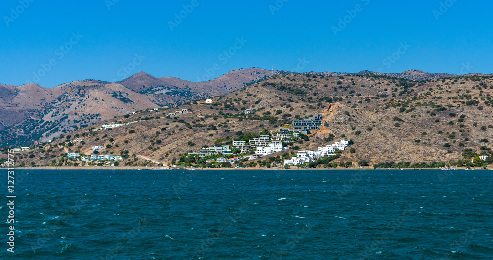 View from the sea on the north coast of Crete, on the west side of the Gulf of Elounda. Crete. Greece.
