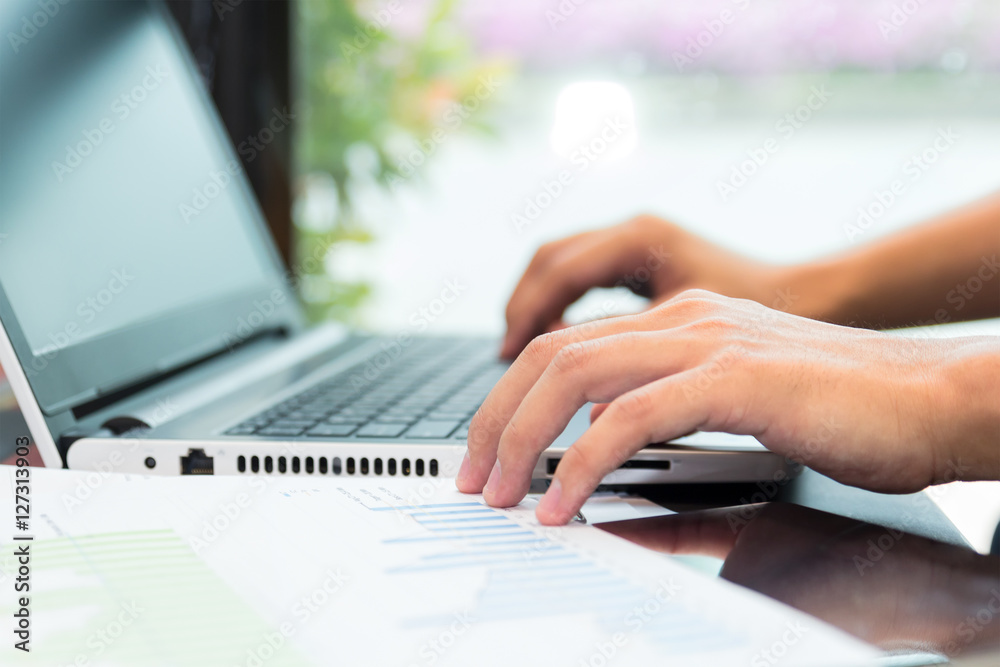 Businessman working by laptop with tablet and smartphone and doc Businessman working by laptop with tablet and smartphone and doc