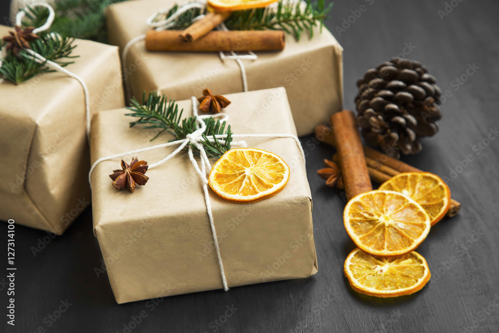 Christmas retro wrapped gifts with dried orange slice and fir tr