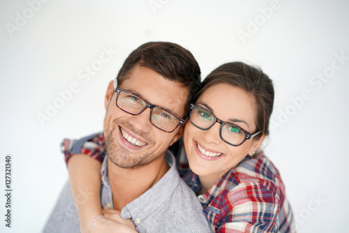 Portrait of middle-aged couple with eyeglasses, isolated