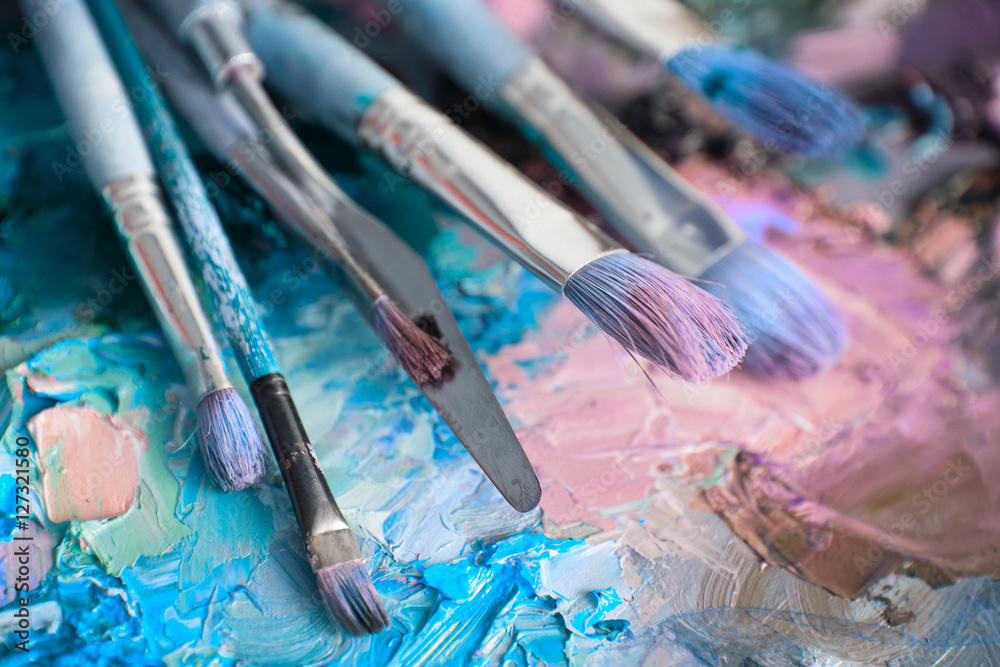 Obraz premium macro artist's palette, texture mixed oil paints in different co