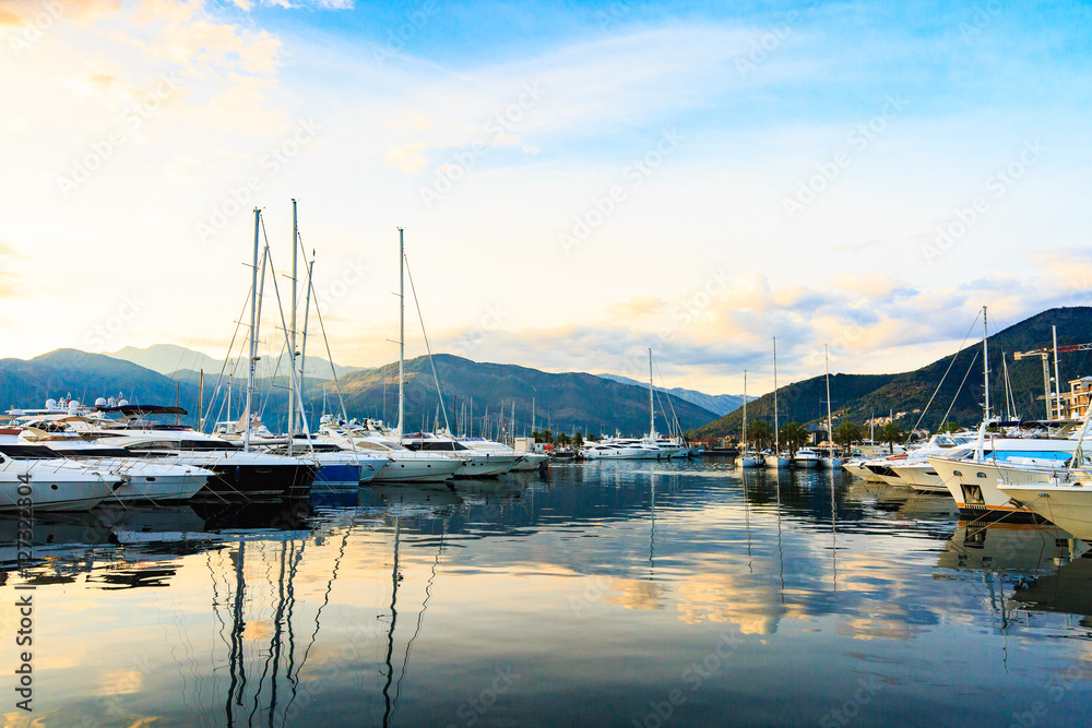 Luxury yacht marina. Port in Mediterranean sea at sunset.