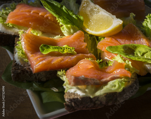 Sandwiches from rye bread with salmon and lemon