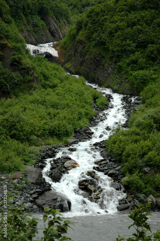 Scenic Mountain River Waterfall with a Natural Ice Bridge Along the Richardson Highway Near Valdez Alaska