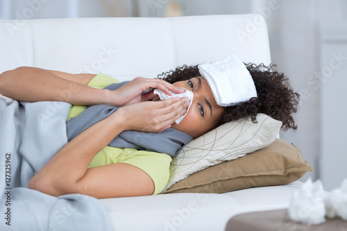 a beautiful ill woman siting on the sofa
