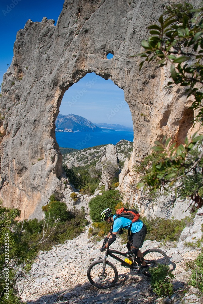 Fototapeta premium Sardinia between mountains and sea - Riding mountain bike