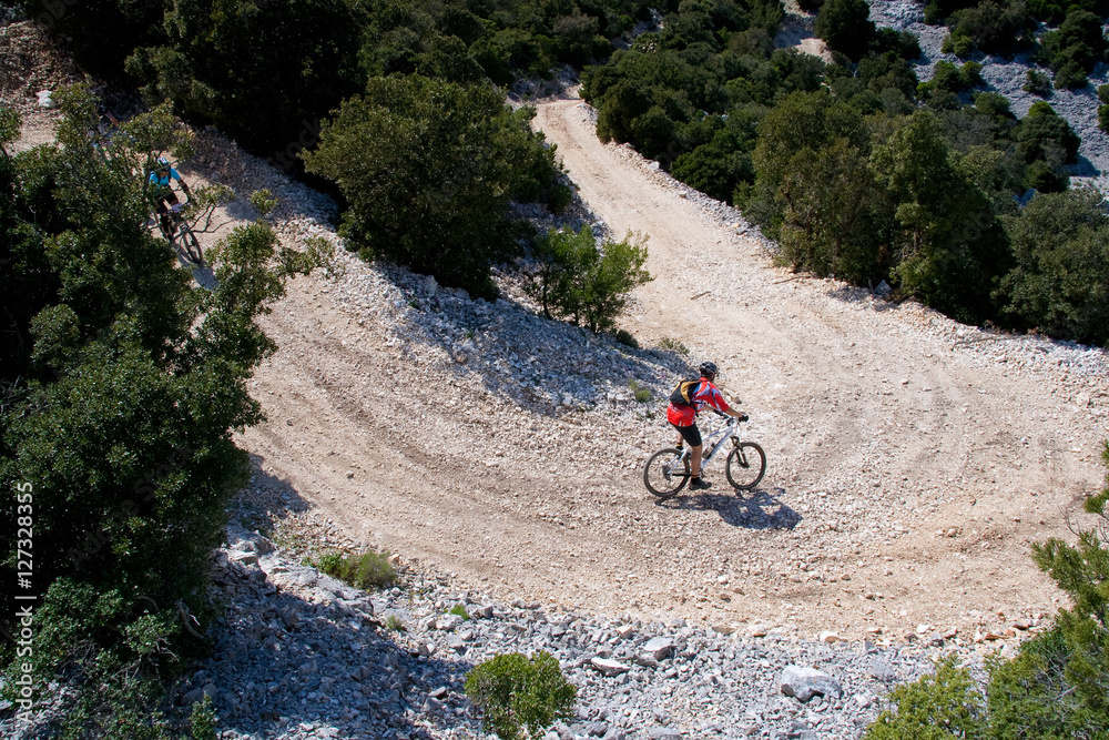Naklejka premium Sardinia between mountains and sea - Riding mountain bike