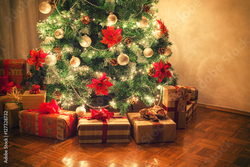Christmas gifts in front of Christmas tree