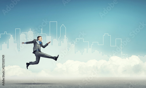 Businessman jumping high © adam121