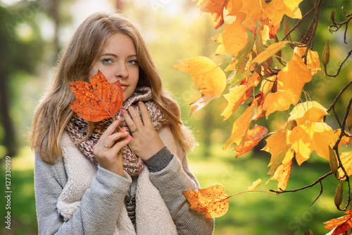 Young woman in the park at autumn