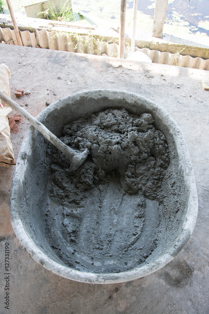 Mixing a cement in salver for applying construction 