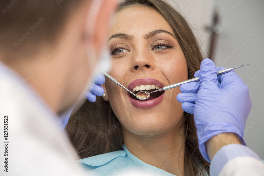 Young woman at the dentist, view from above Young woman at the dentist, view from above
