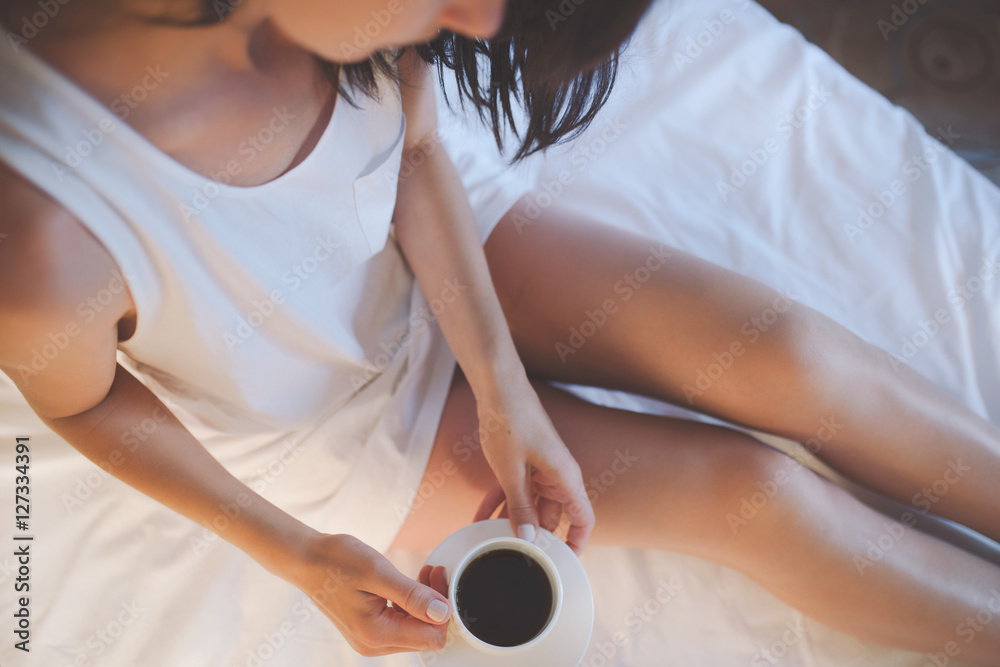 Fotografia do Stock: Sexy woman relaxing on fluffy bed. Female