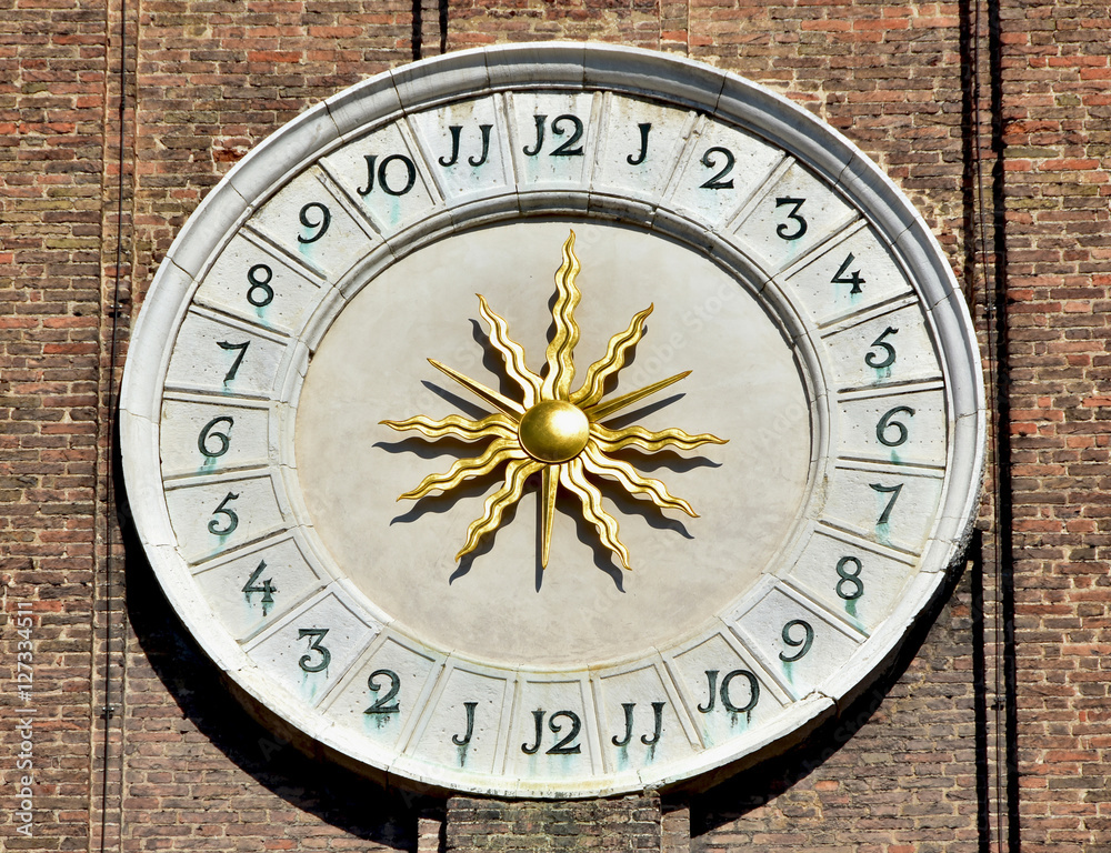 Santi Apostoli church old clock with sun at the center in Venice Santi Apostoli church old clock with sun at the center in Venice