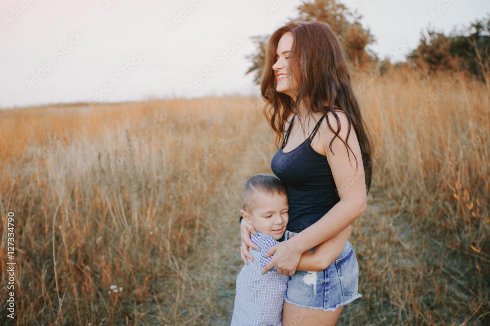young family with a child have fun outdoors young family with a child have fun outdoors