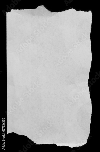 White rip torn paper on black background