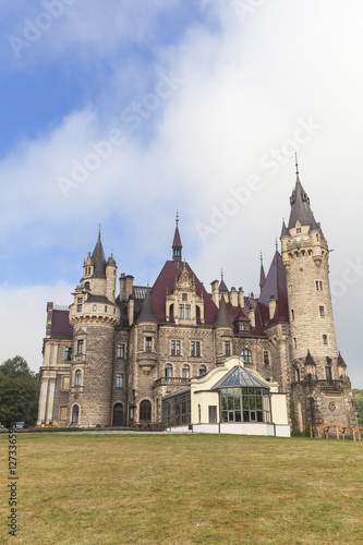 View on 17 th century Moszna Castle on a sunny day, Poland