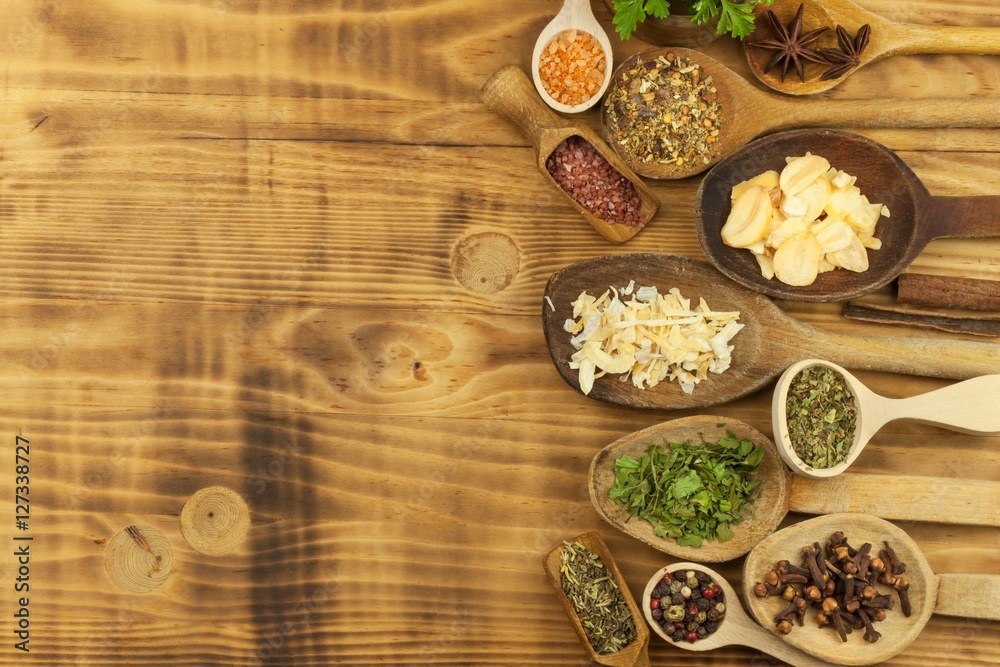 Various kinds of spices on the kitchen table. Seasoning food. Sales of exotic spices. Advertising on spices. Powder spices on spoons in wooden table background.
Various kinds of spices on the kitchen table. Seasoning food. Sales of exotic spices. Advertising on spices. Powder spices on spoons in wooden table background.