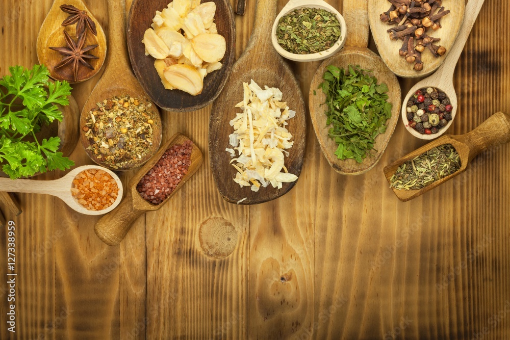 Various kinds of spices on the kitchen table. Seasoning food. Sales of exotic spices. Advertising on spices. Powder spices on spoons in wooden table background.
Various kinds of spices on the kitchen table. Seasoning food. Sales of exotic spices. Advertising on spices. Powder spices on spoons in wooden table background.