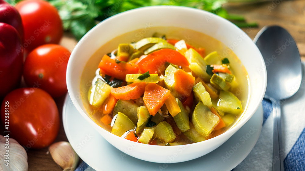 A bowl of traditional italian minestrone soup with ingredients A bowl of traditional italian minestrone soup with ingredients