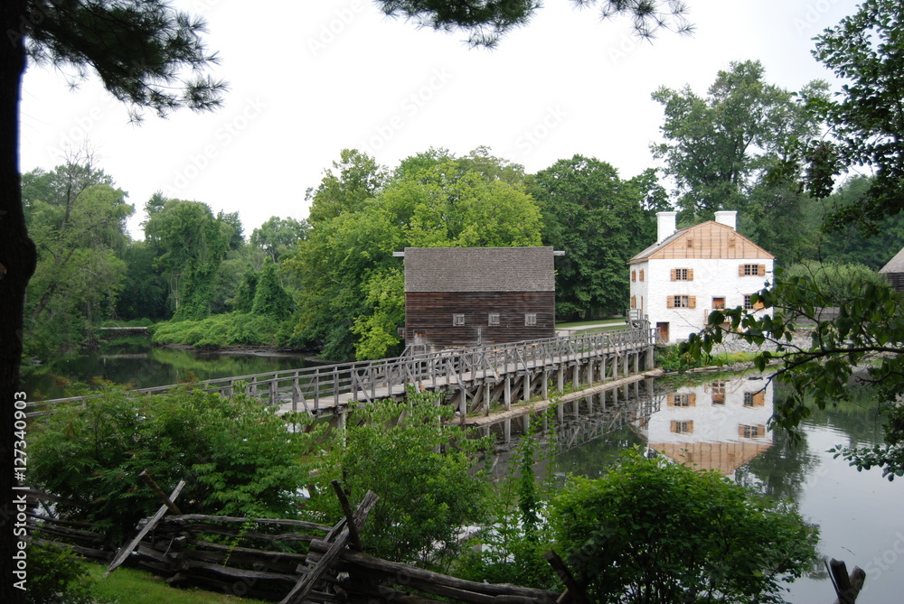 New England Farm and grain mill on a river