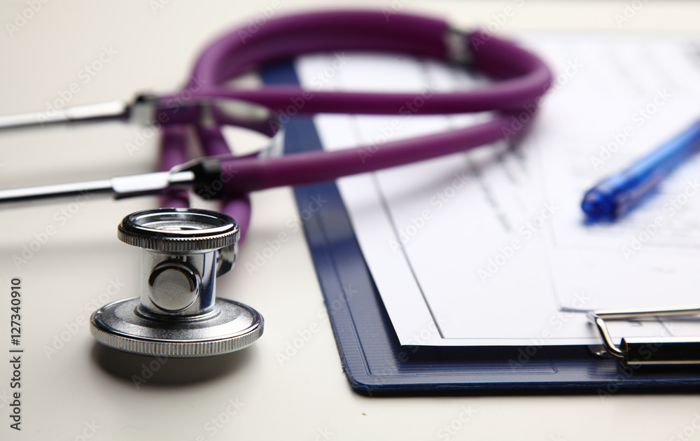 Closeup of a medical stethoscope with folder Closeup of a medical stethoscope with folder