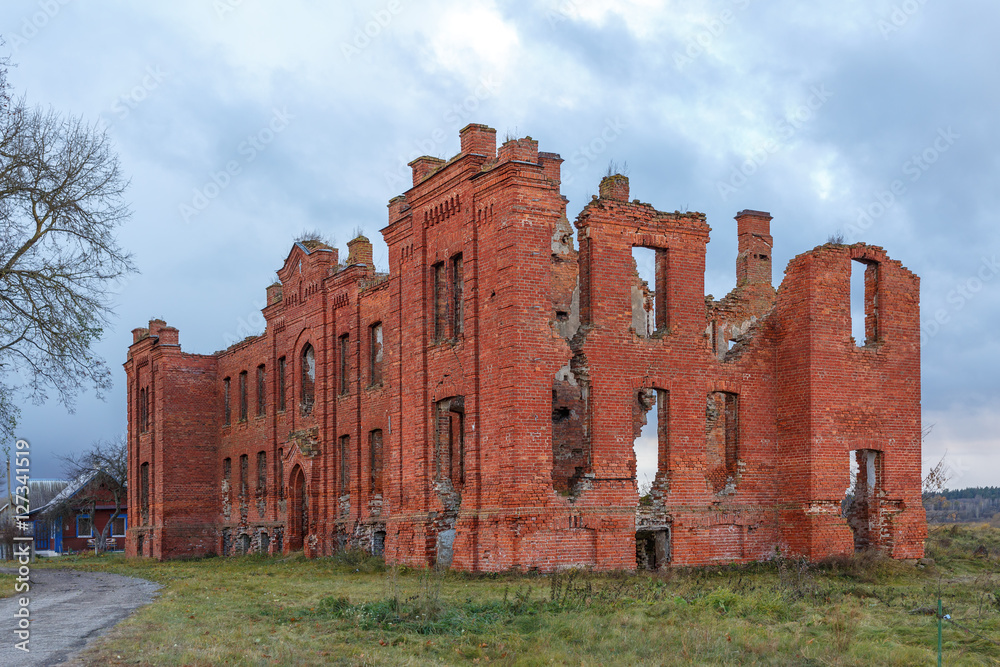 The ruins of the hospital in the small city of Belarus. The ruins of buildings of red brick. The building is dilapidated. An ancient city where Jews lived