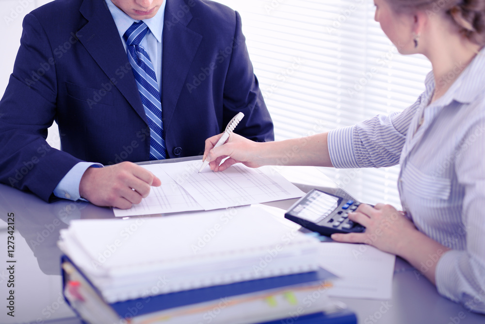 Bookkeepers or financial inspector making report, calculating or checking balance. Audit concept. Bookkeepers or financial inspector making report, calculating or checking balance. Audit concept.