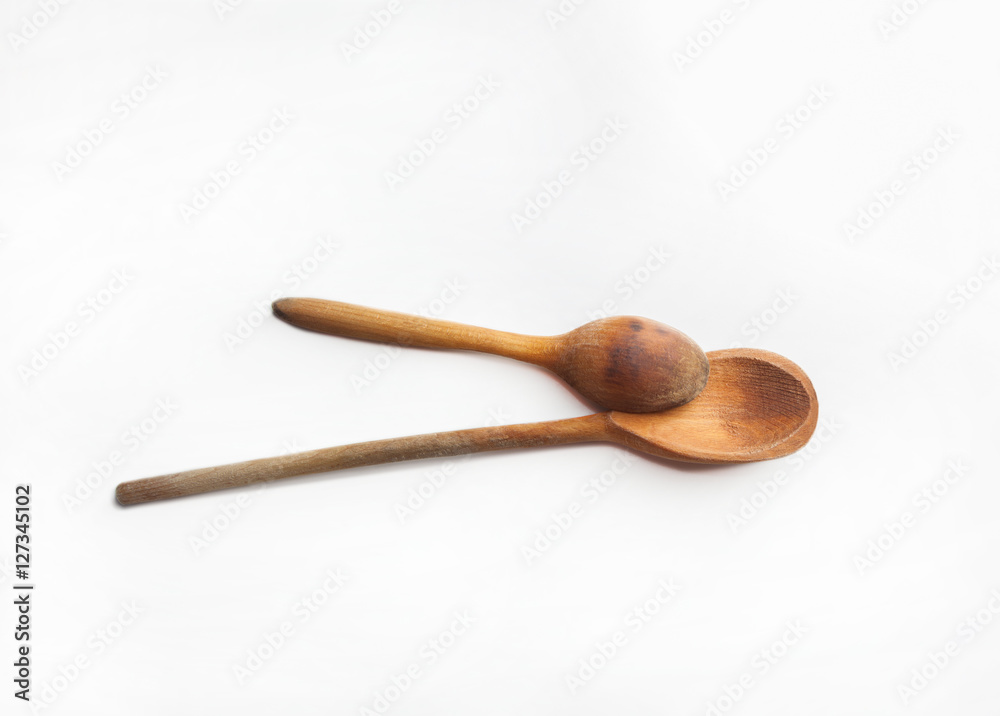 Two wooden spoons isolated on white background Two wooden spoons isolated on white background
