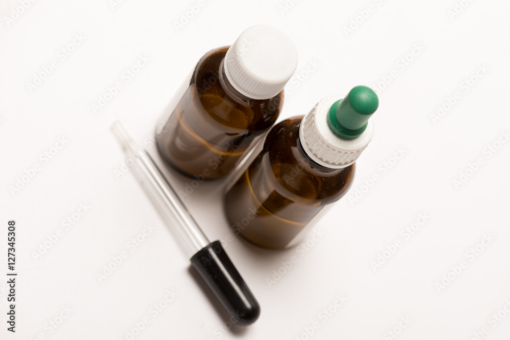 Dropper bottles on white background for drop medication Dropper bottles on white background for drop medication