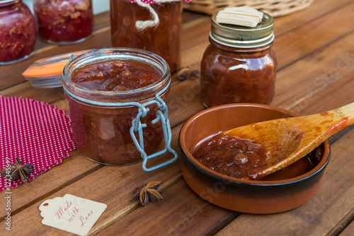 Jars with homemade plum chutney photo