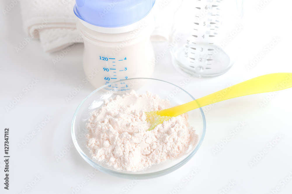 preparation of mixture baby feeding on white background preparation of mixture baby feeding on white background